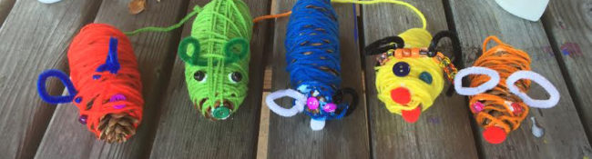 youth education activity of colorful animals made from yarn like pigs, tigers and bumblebees
