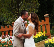 bride and groom at the gardens kissing in spiring