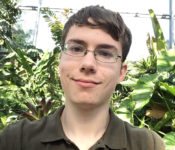 photo of intern smiling in the tropical plant conservatory