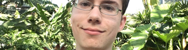 photo of intern smiling in the tropical plant conservatory