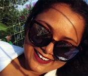 Reiman Gardens intern smiling while wearing sunglasses