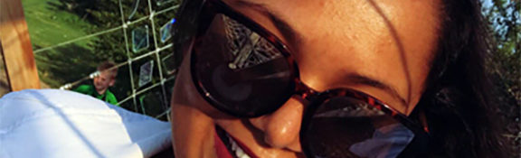 Reiman Gardens intern smiling while wearing sunglasses
