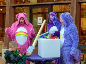 outdoors at Reiman Gardens during Spirits in the Gardens event with a candy slide with people dressed in costumes
